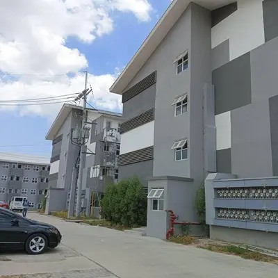 a black car parked in front of a building at Blk Pod in Punta
