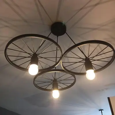three lights hanging from the ceiling in a room at Blk Pod in Punta