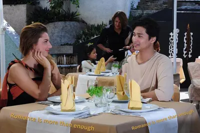 a man and a woman sitting at a table at Date & Dine Resort in Antipolo