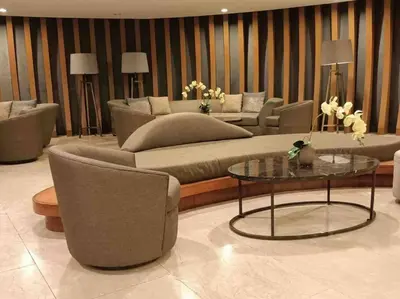 a living room with a couch and chairs and a table at Shore 2 Staycation - Near Mall of Asia and Casinos in Manila