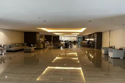 a lobby of a hotel with couches and tables at Luxury Air Residences By Makati in Manila