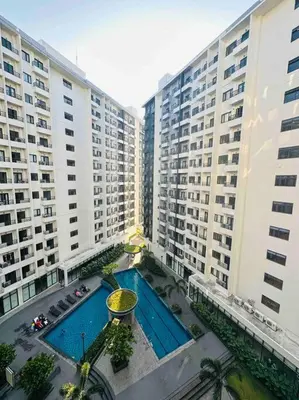 an overhead view of two large buildings and a swimming pool at Jeced Condotel at Spring Residences near Airport in Manila