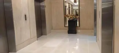 a hallway of a building with a vase of flowers at The SPARKLE Comfortable living by Awsom Phil in Manila