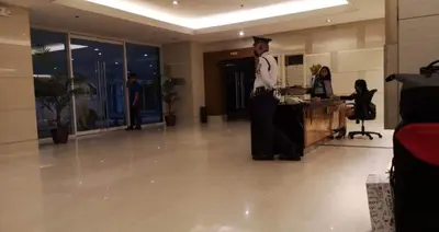 a woman in a graduation gown standing in a room at The SPARKLE Comfortable living by Awsom Phil in Manila