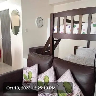 a living room with a couch and a bunk bed at The SCENIC: Comfortable living by Awsom Phil in Manila