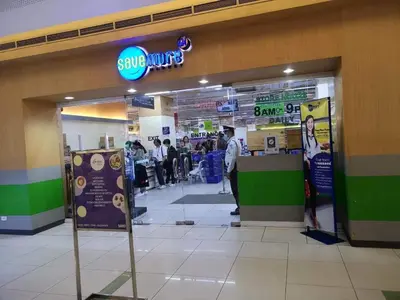 a store entrance with a smile union sign in a store at The SCENIC: Comfortable living by Awsom Phil in Manila