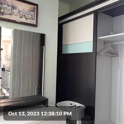 a large mirror on a wall in a room at The SCENIC: Comfortable living by Awsom Phil in Manila