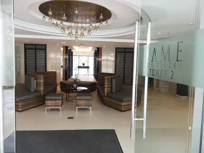 a room with chairs and a chandelier in a store at The ICONIC: Comfortable living by Awsom Phil in Manila