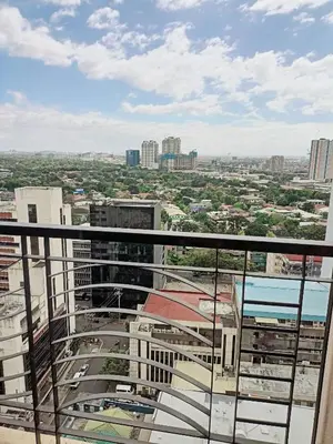 a view of a city from the top of a building at 20h staycation away from home in Manila