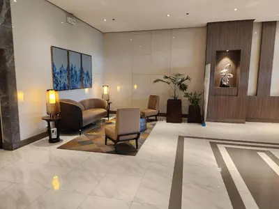 a lobby of a hotel with a waiting room at 81 Newport C5 10i Balcony & Pool across NAIA T3 in Manila