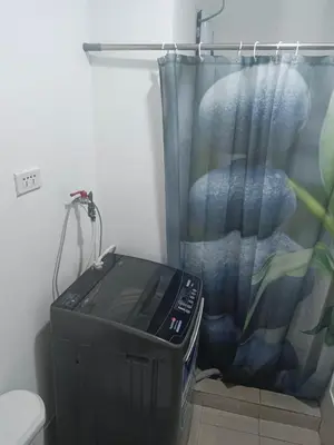 a television in a bathroom with a shower curtain at Happy Stays A - 300mbps - 65