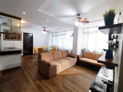 a living room with a couch and a table at SULIT CONDO Unit 2 Santa Mesa Manila in Manila