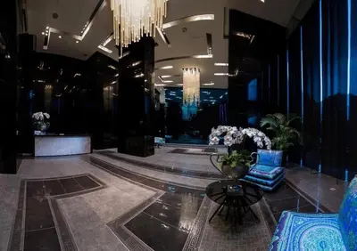 a lobby with a chandelier and a table and chairs at The Milano Residences by Versace Stylish 1BR Condo in Manila