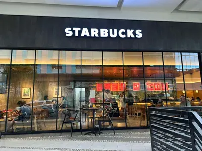 a starbucks store with a table in front of it at NAIA Terminal 3 Insane Interior, Be the Boss in Manila