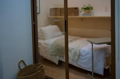 a bedroom with a bunk bed and a mirror at NUVALI Amaia Steps Parkway 2 BR Condo THE SANCTUARY with pool, free parking near Carmelray Industrial Park, Ayala Solenad, Xavier School in Pitland
