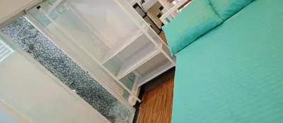 a room with a bed and a window at KS RESIDENCES in Manila