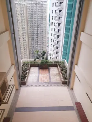 a view from the floor of a building with tall buildings at mandaluyong 2 br condo for rent in Manila