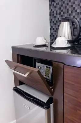 a drawer in a counter with a microwave at Nest Nano Suites Poblacion - Makati in Manila