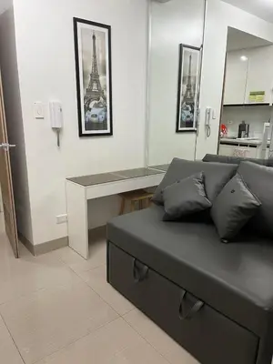 a living room with a couch and a table at Overnight @ Shakhbot's in Manila