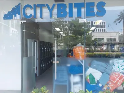a store window with the sign for cityites at Overnight @ Shakhbot's in Manila