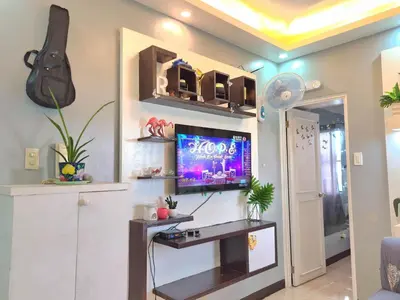 a living room with a tv on a wall at Budget-friendly Transient Near Pasig/Mandaluyong in Cainta