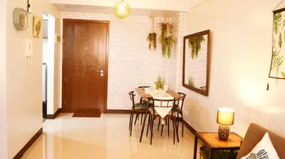 a dining room with a table and chairs at Manila Airport Staycation near NAIA Terminal 3 in Manila
