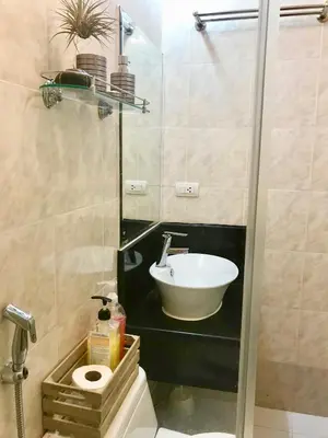 a bathroom with a sink and a toilet and a shower at Manila Airport Staycation near NAIA Terminal 3 in Manila