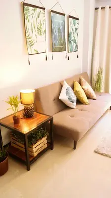 a living room with a couch and a table at Manila Airport Staycation near NAIA Terminal 3 in Manila