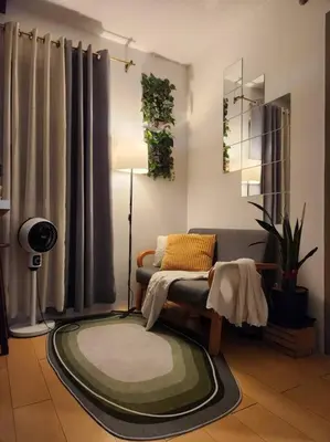 a living room with a couch and a rug at Amari Homestay @ Sorrento Oasis Condominium in Manila