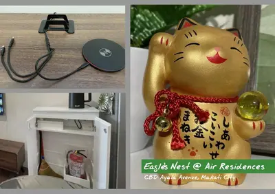 a cat statue of a cat wearing a red collar at City View Condo Unit with Netflix & Wifi in Ayala Avenue Makati City in Manila
