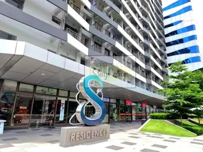 a building with the s sign in front of it at Condo in Pasay S Residences in Manila