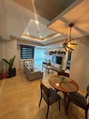 a living room with a table and a couch at Exquisite Stays Private 2BR Rental in Manila