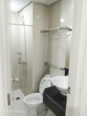 a bathroom with a toilet and a sink at Pasay Condotel near NAIA terminal 3 (3 mins walk in) in Manila