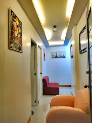 a living room with a couch and a chair at Budget Accomodation in San Pablo City Laguna in Manila
