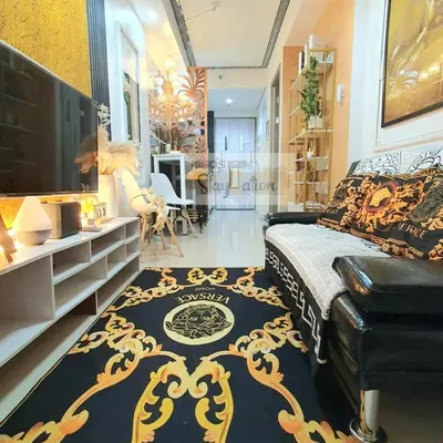 a bedroom with a bed and a black and gold rug at Kuro's Krib One Bedroom Condo Unit with Balcony at S Residences Pasay City MOA in Manila