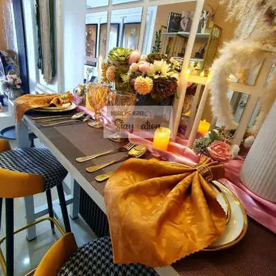 a dining room table with a yellow table cloth on it at Kuro's Krib One Bedroom Condo Unit with Balcony at S Residences Pasay City MOA in Manila
