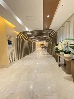 a hallway in a building with a tunnel at Jejo Suite Home Shore 3 Residences Staycation 1 BR Unit Near MOA with Netflix and Prime Video in Manila