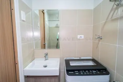 a small bathroom with a sink and a mirror at Blissful Haven Suite Staycation Pasay Metro Manila near SM Mall of Asia Naia Airport Okada in Manila