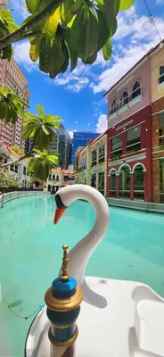 a fountain in front of a swimming pool at 12e Spacious Cozy Suite at The Venice Mall with FREE Parking and Washing Machine in Manila