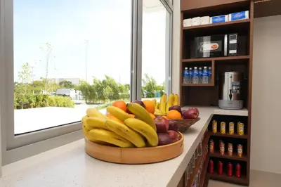 a bowl of fruit on a counter in a kitchen at Athlete's House in Imus