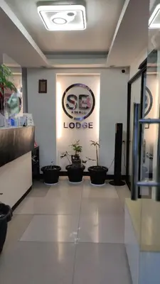 a lobby of a store with potted plants on the wall at SB LODGE TAGUIG in Manila