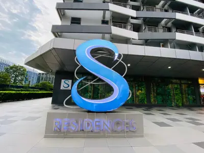 a blue s sign in front of a building at S Residences Condo PoolView Balcony in SM MOA near NAIA in Manila