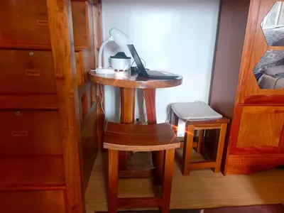 a small table with a lamp on it in a room at Happy Stays B - 300mbps - 65