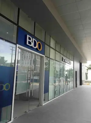 a bdo sign on the side of a building at Minju Staycation at Fame Residences Free Netflix & Wifi in Manila