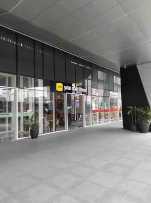 a store front of a building with potted plants at Minju Staycation at Fame Residences Free Netflix & Wifi in Manila