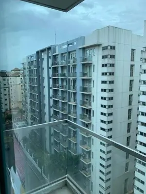 a view of a large apartment building from a balcony at Airport staycation @MRMCONDOTEL in Manila