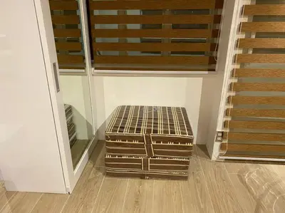 a empty room with a bench in front of a door at Cozy60sqm 1BR balcony/prking/Wifi/Ntflix near Mall in Manila