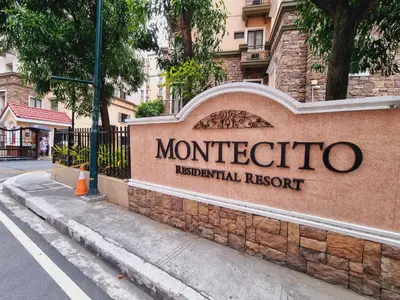 a sign for a monticello hospital resort on a street at Modern Minimalist Condo near Airport in Manila