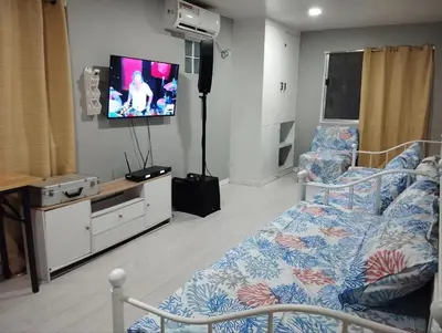 a hospital room with a bed and a flat screen tv at 9 Guest - Unit 1 House Type in Pasong Mannga