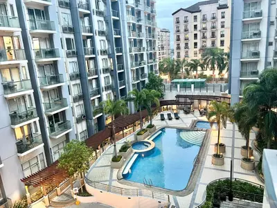 an overhead view of a swimming pool in a building at Kiel 4-Star Condo Hotel Near NAIA Manila Airport Terminal in Manila